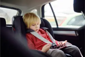 Learn how to strap your child correctly in a car seat
